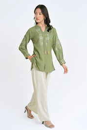 indigrey sage green Ivy shirt with fly brick stitch floral embroidery on neckline and sleeves and tassel hem details