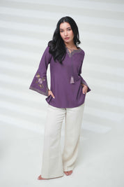 indigrey Zuri purple top with floral Sketchfill Cord embroidery and flared bell sleeves worn by a woman