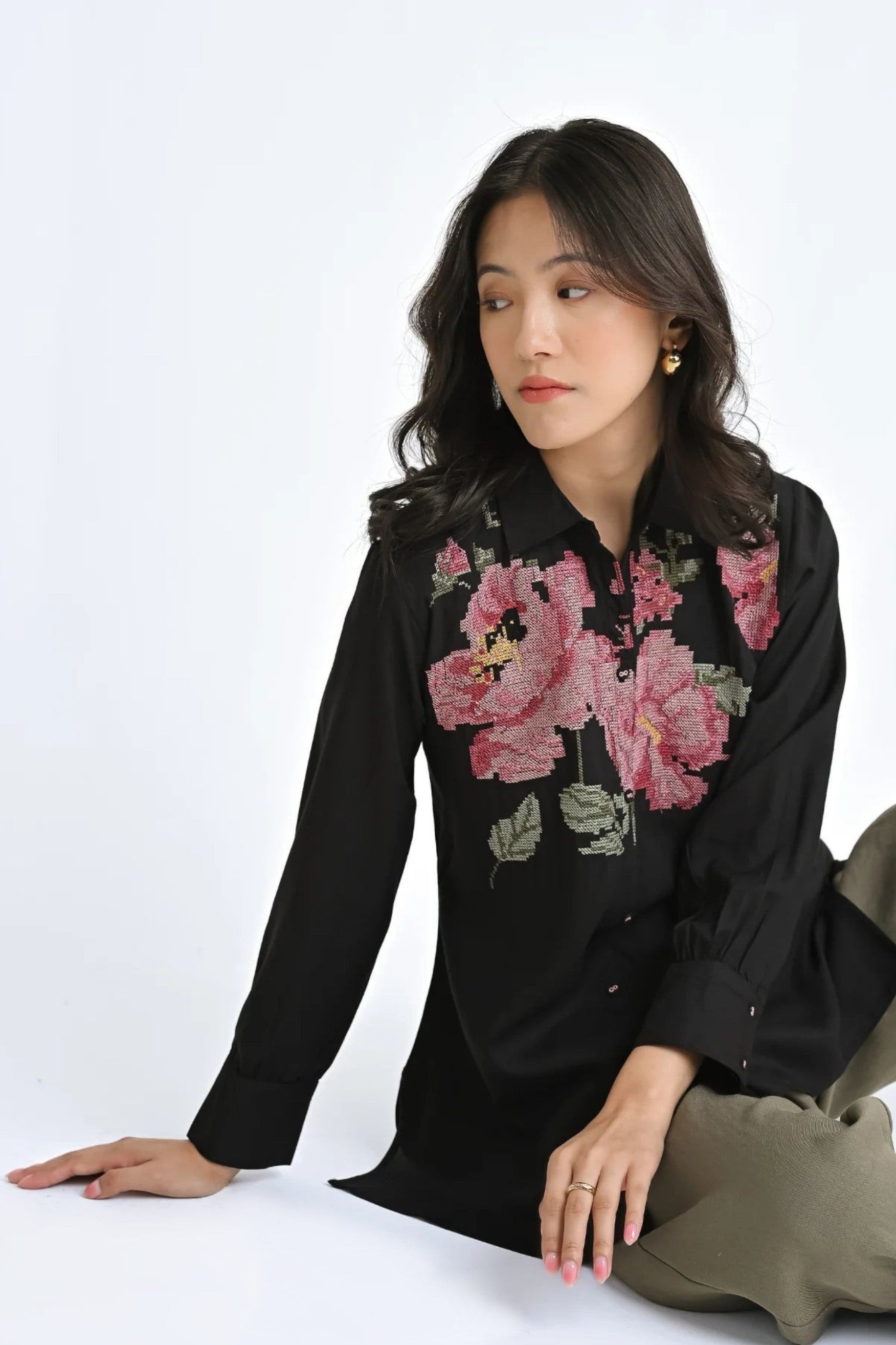 indigrey Ambrosia black shirt featuring intricate pink floral pixel cross stitch embroidery and a relaxed fit.