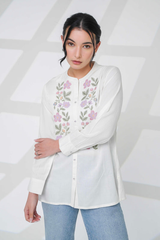 indigrey Aurora white shirt featuring delicate floral cross-stitch embroidery and a mandarin collar worn by a model
