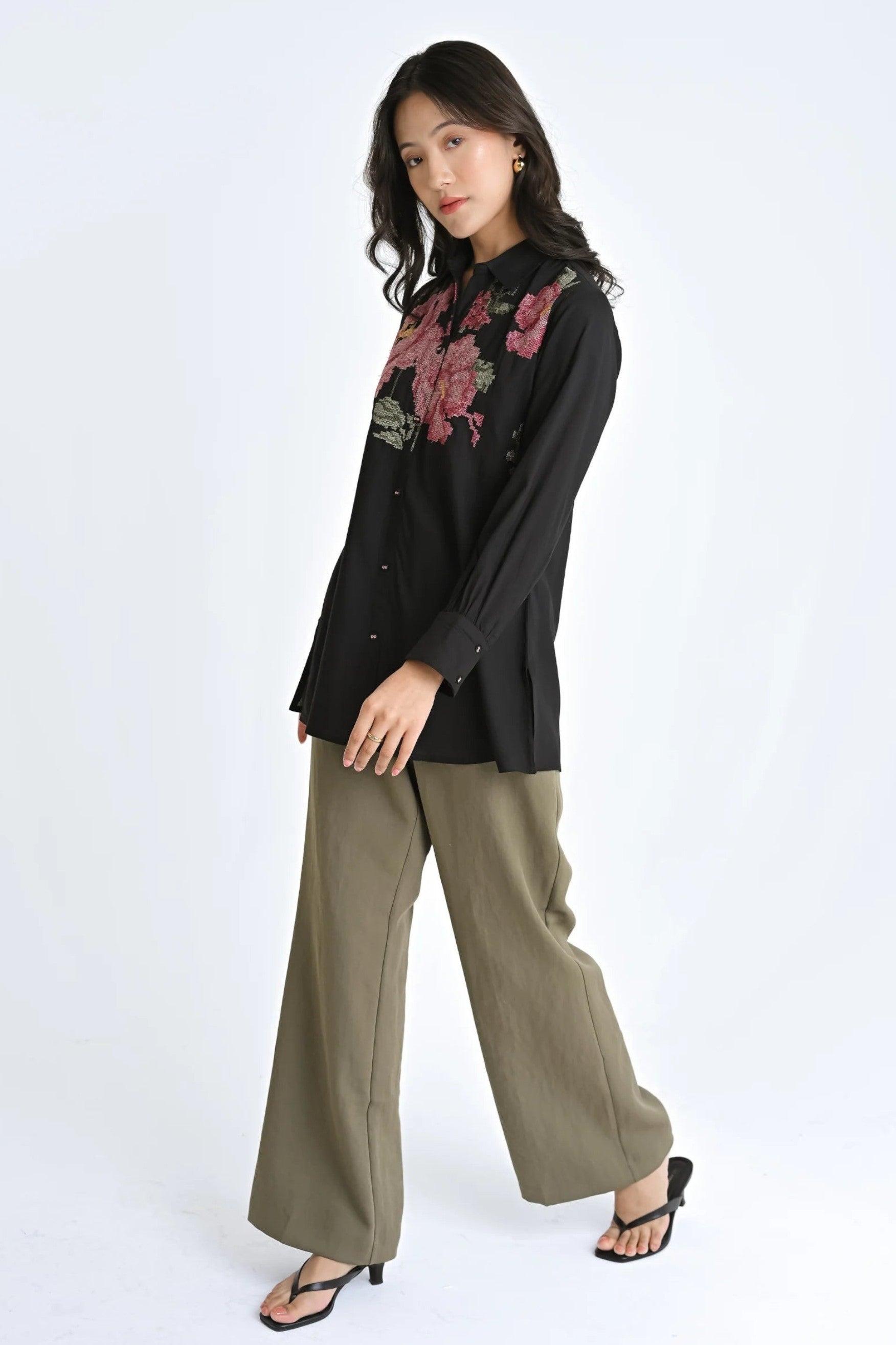 indigrey black shirt with floral pixel cross stitch embroidery worn by a model with olive wide-leg trousers
