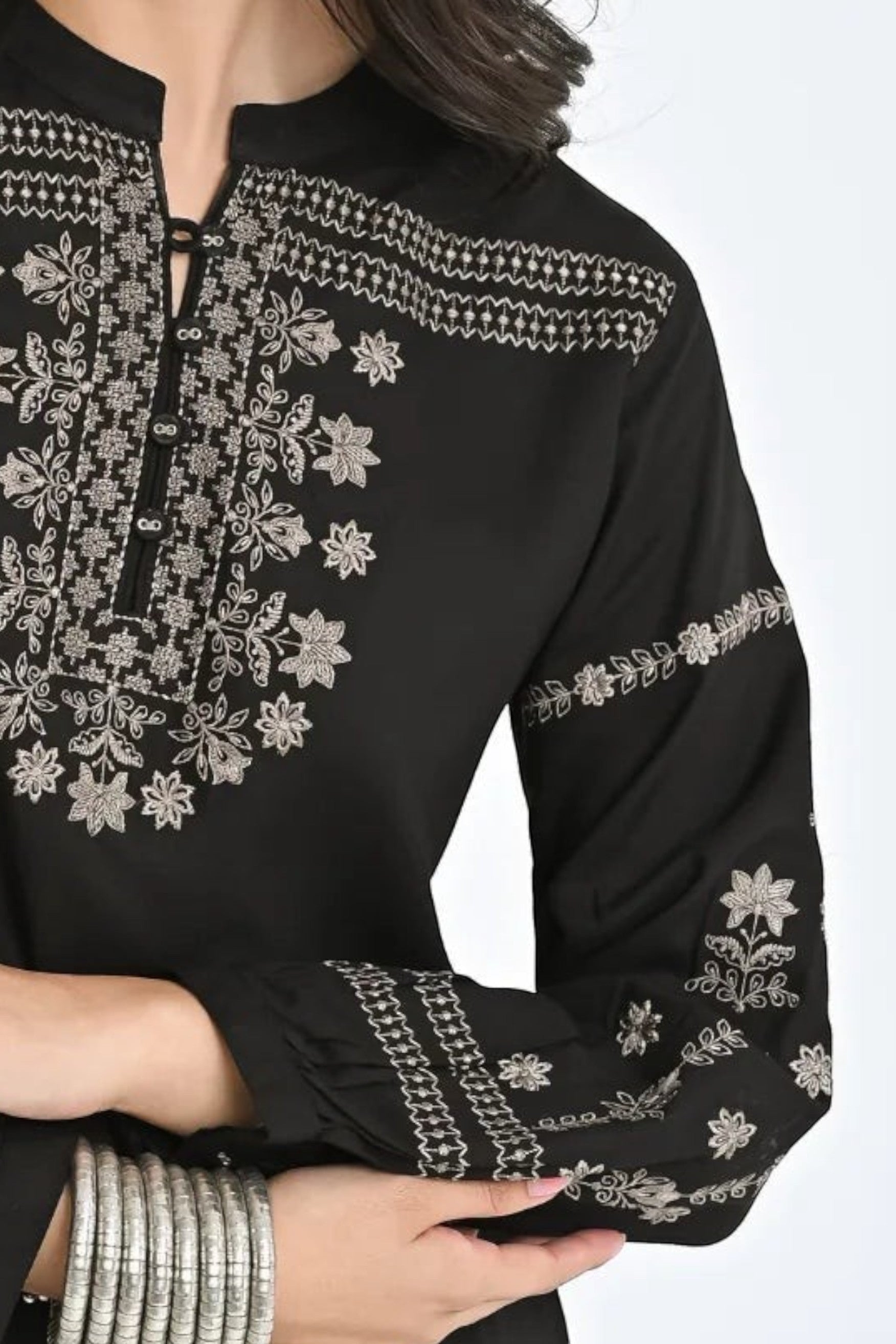 indigrey black straight-fit top with intricate white latticework and floral embroidery on neckline and sleeves