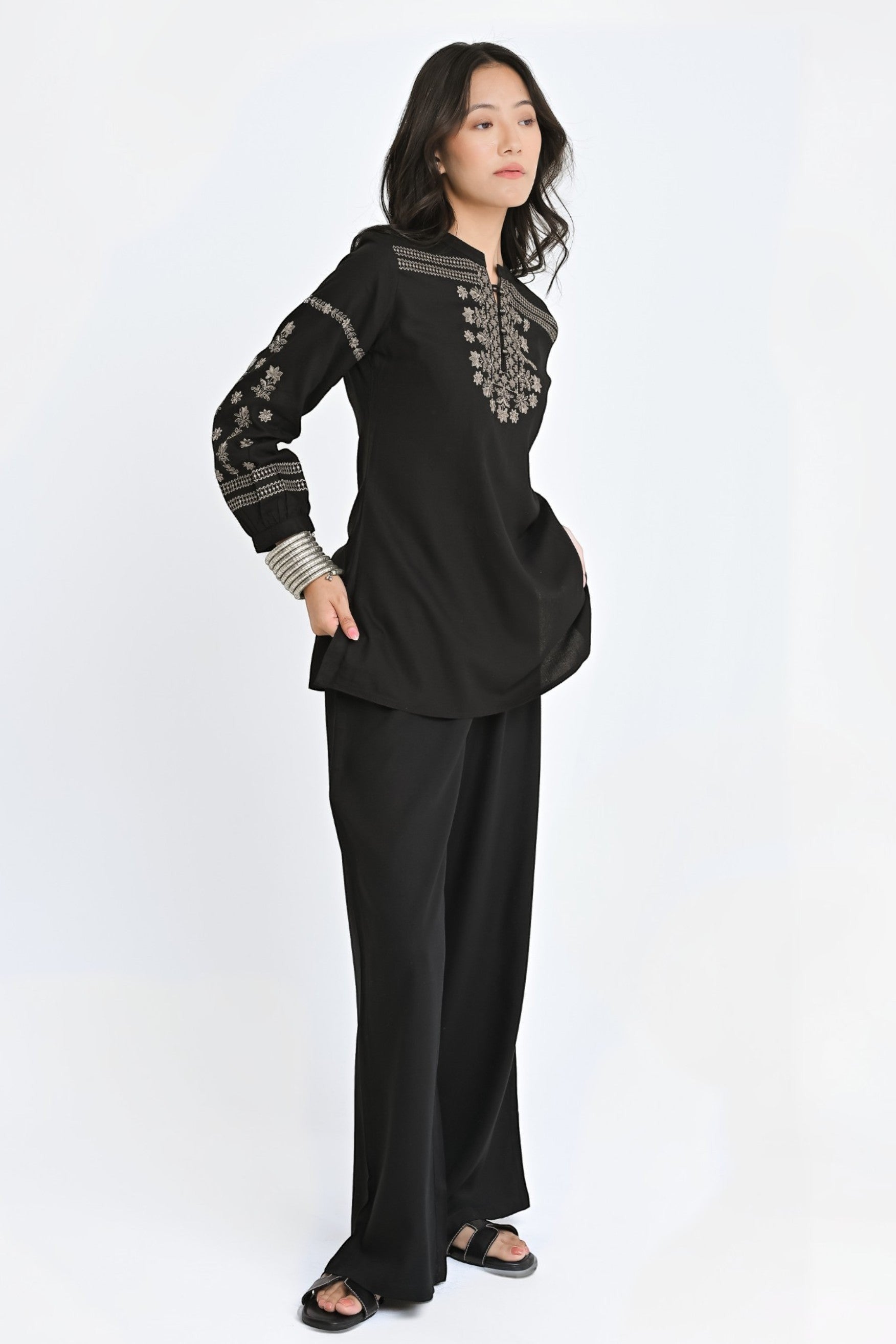 indigrey black straight-fit top with intricate latticework embroidery and floral detailing on sleeves and neckline