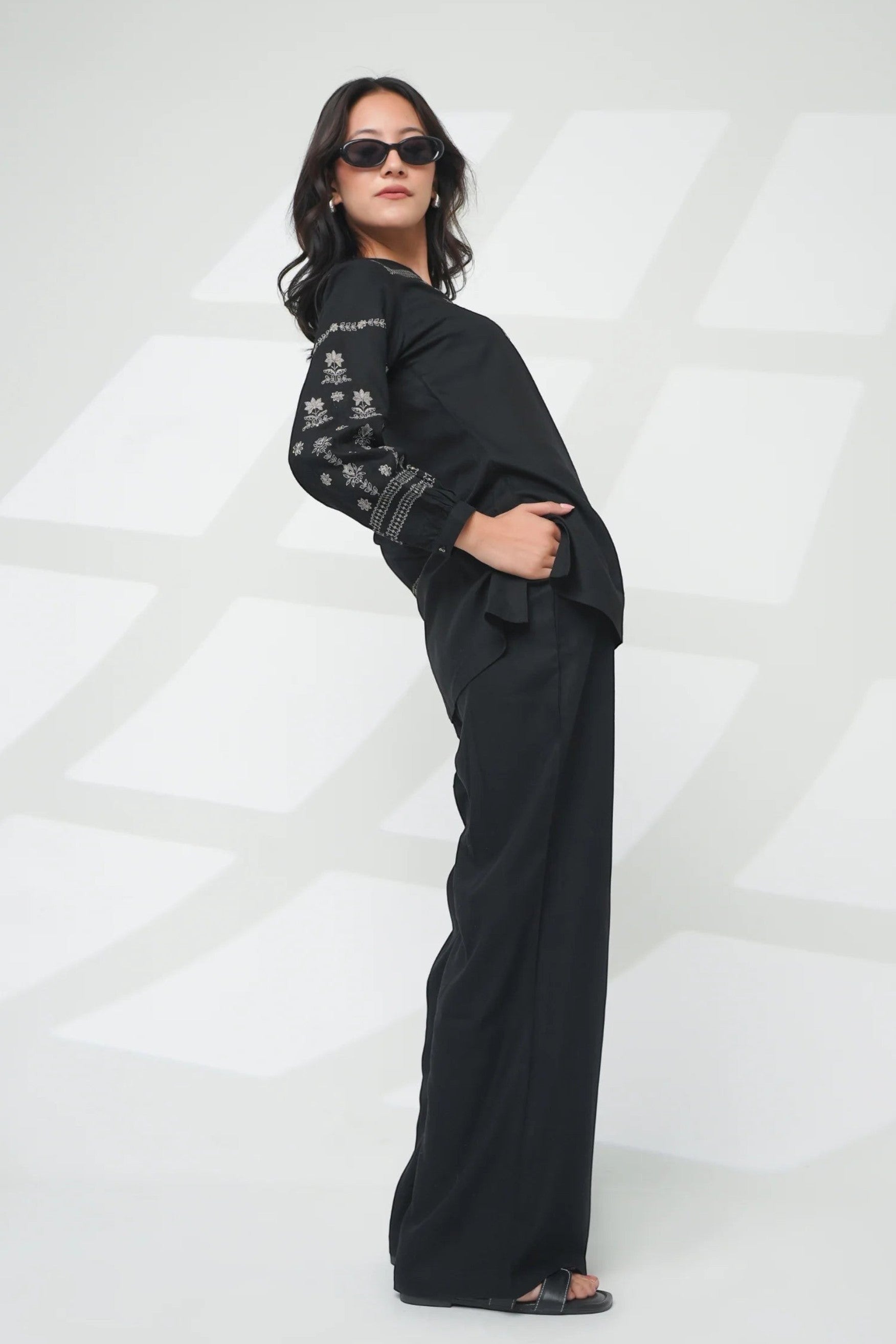 indigrey black straight-fit top with intricate latticework embroidery and floral details on sleeves and neckline