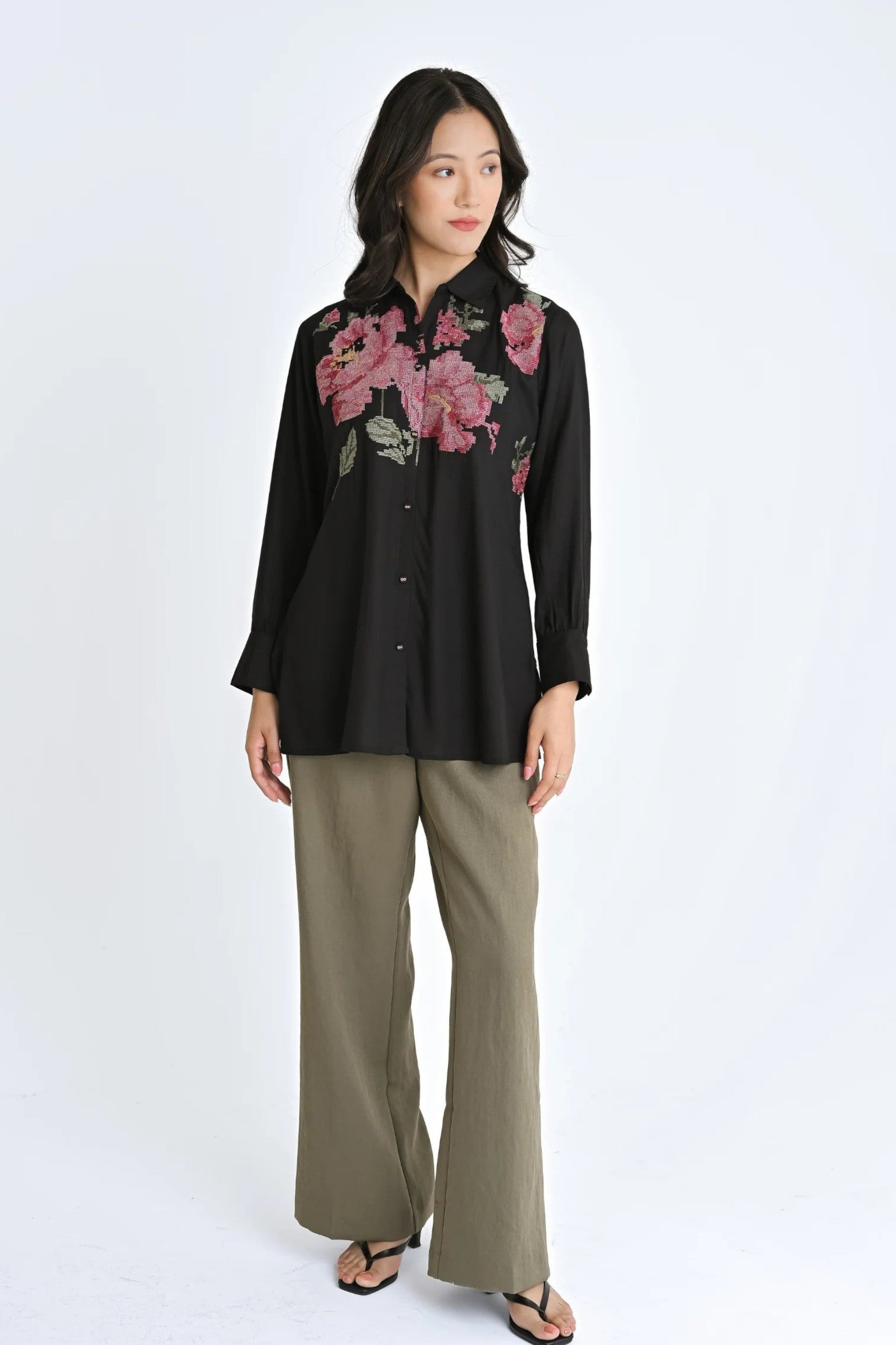 indigrey black shirt with floral pixel cross stitch embroidery worn by a model with olive wide-leg trousers
