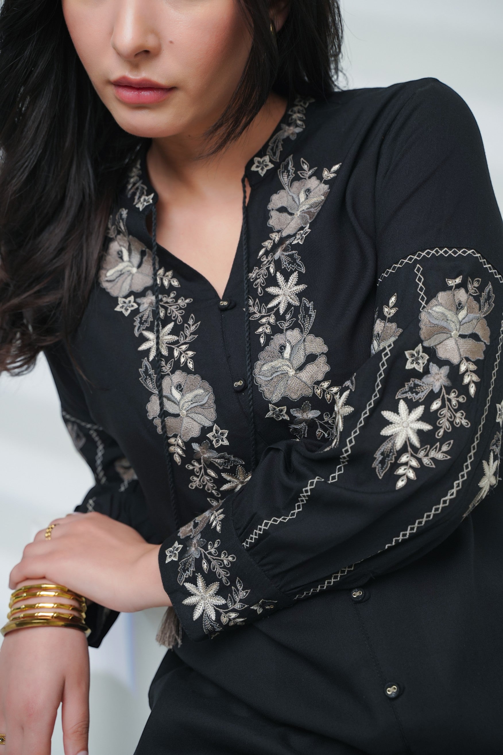 indigrey black shirt featuring intricate floral Fly Brick stitch embroidery on the neckline and sleeves