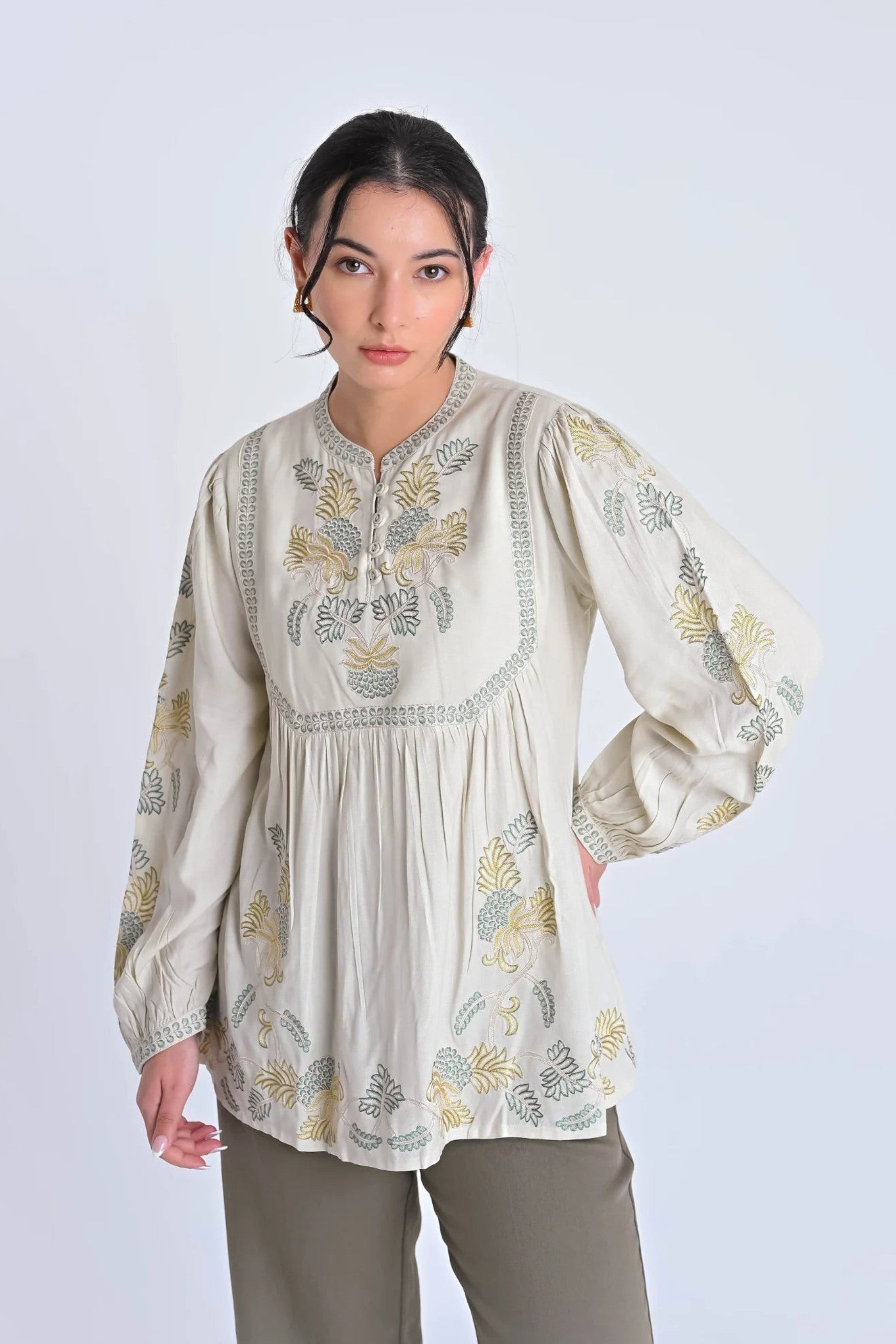 indigrey Dahlia ivory top featuring intricate tonal pebblework embroidery on the yoke, sleeves, and hem.