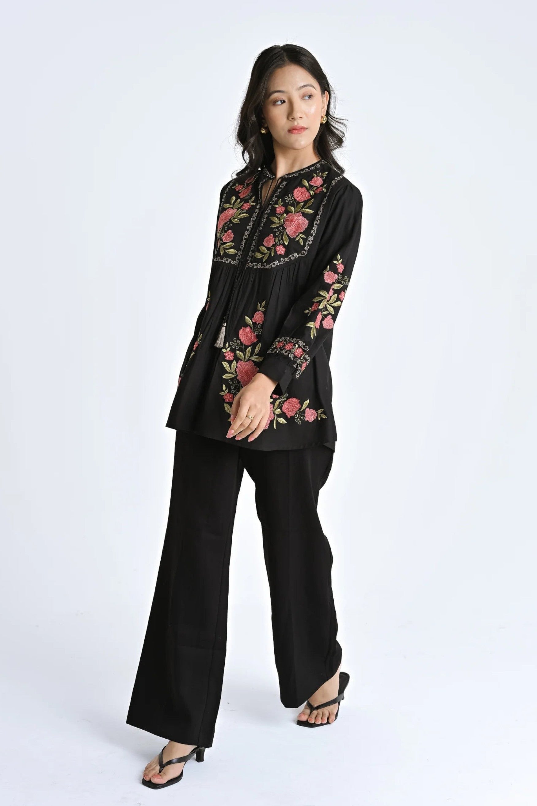 indigrey Goa black top featuring vibrant Tatami gradient floral embroidery, gathered fabric, and voluminous sleeves.