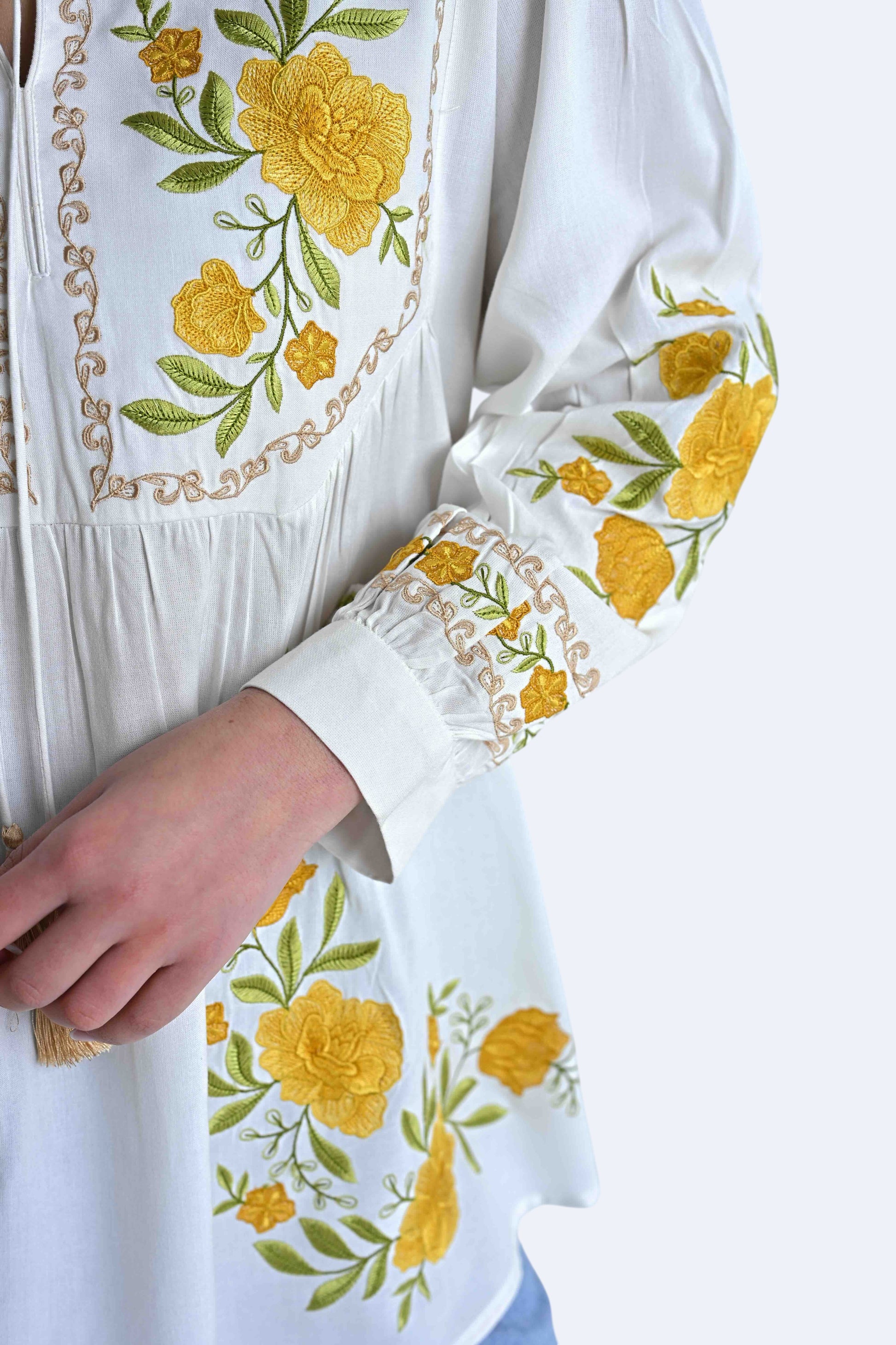 indigrey white Goa top featuring yellow floral tatami gradient embroidery on the yoke and gathered sleeves.