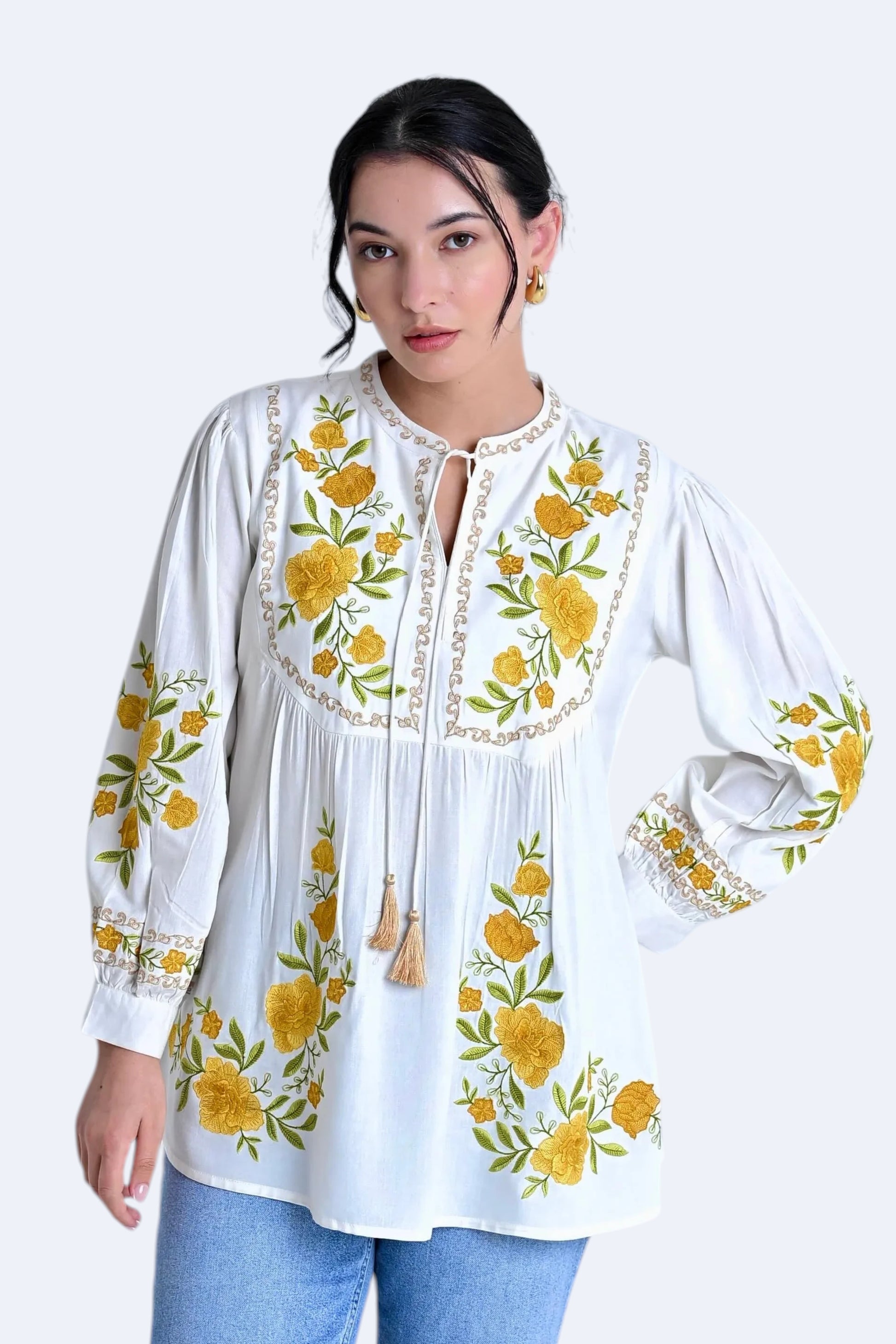 indigrey Goa white top with yellow floral Tatami gradient embroidery on yoke and sleeves, worn with blue jeans