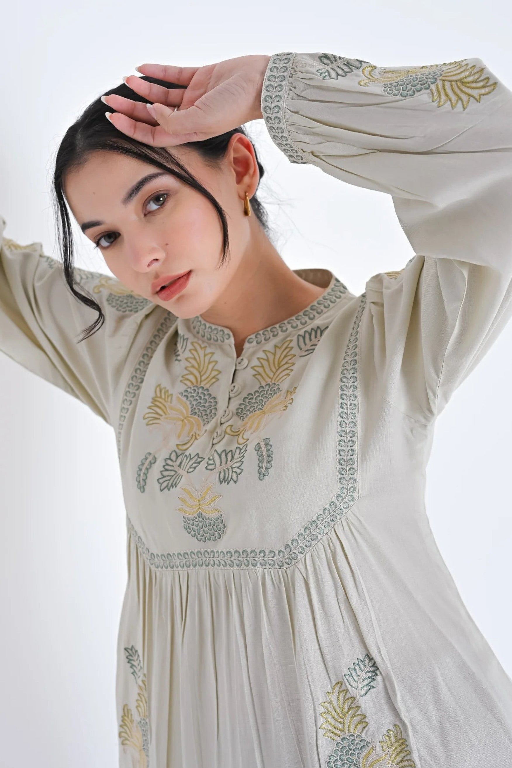 indigrey ivory Dahlia top with muted tonal pebblework embroidery on yoke and sleeves worn by a woman