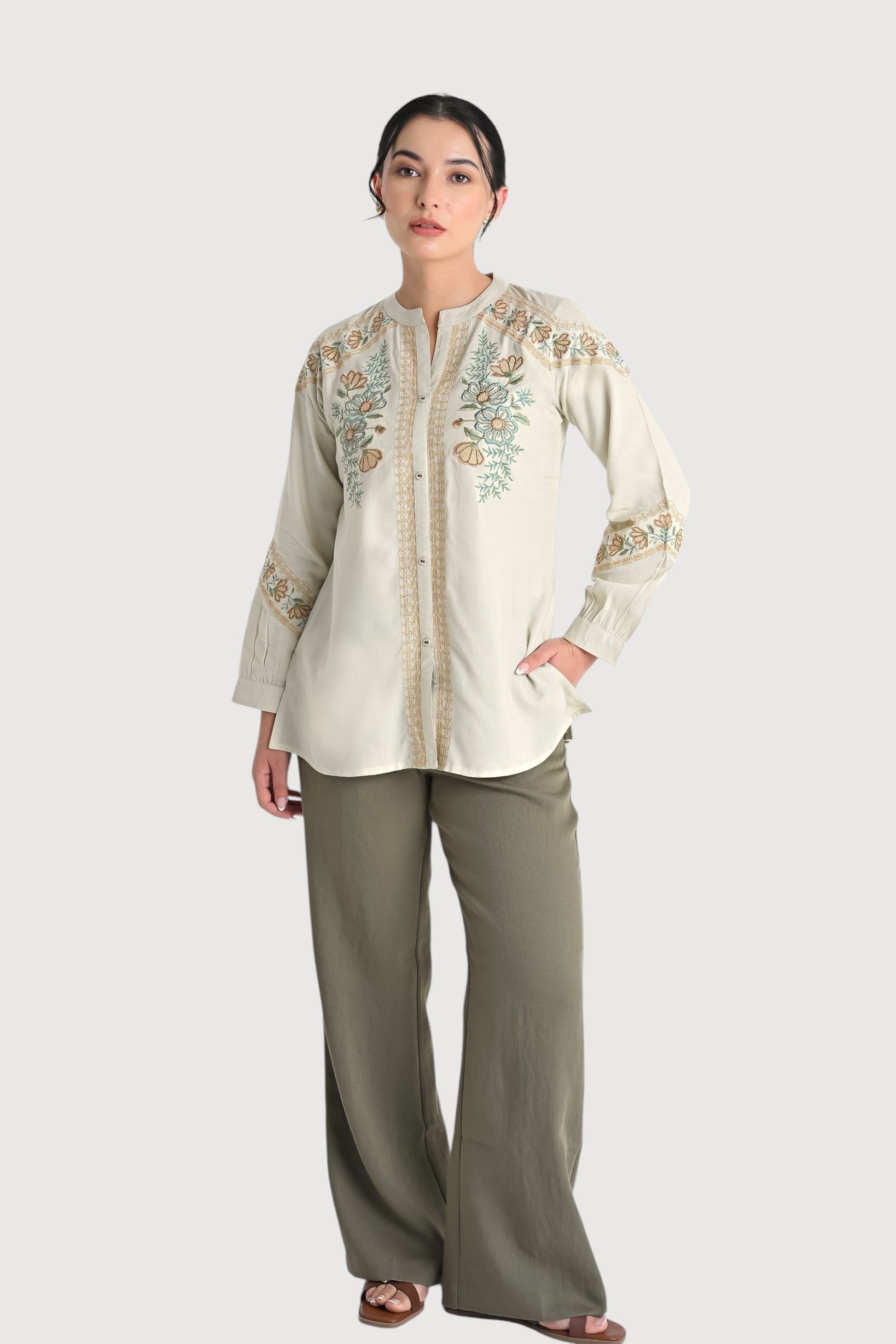 indigrey ivory shirt with earthy chain tatami floral embroidery on yoke and sleeves, worn with olive wide-leg trousers