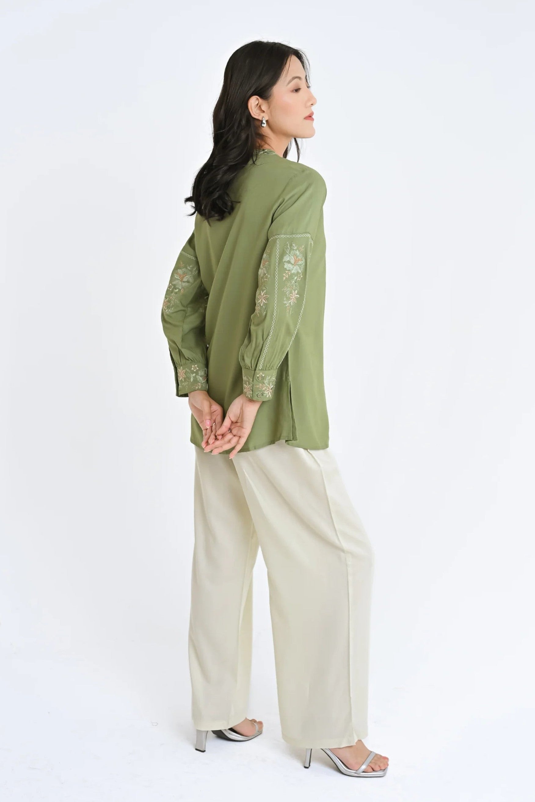 indigrey Ivy sage shirt featuring Fly Brick stitch floral embroidery on sleeves and tassel hem details