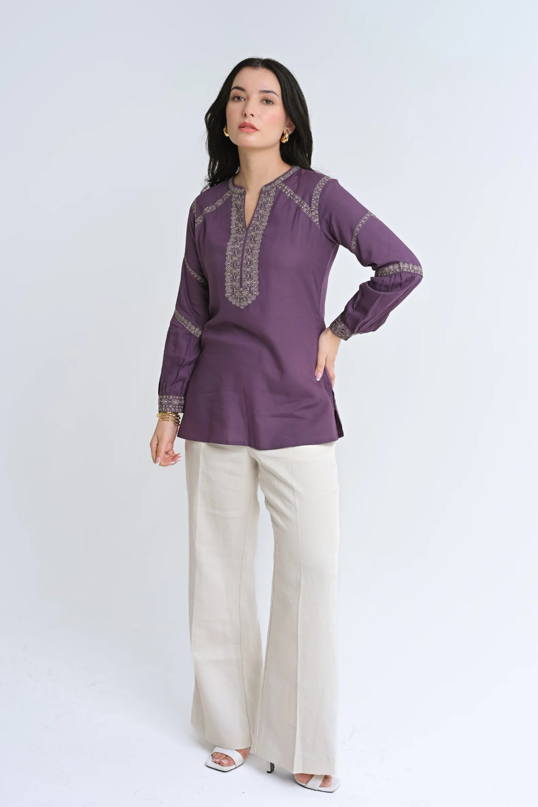 Model wearing an indigrey purple June top with intricate tonal floral Filigree Traceline embroidery and long sleeves.