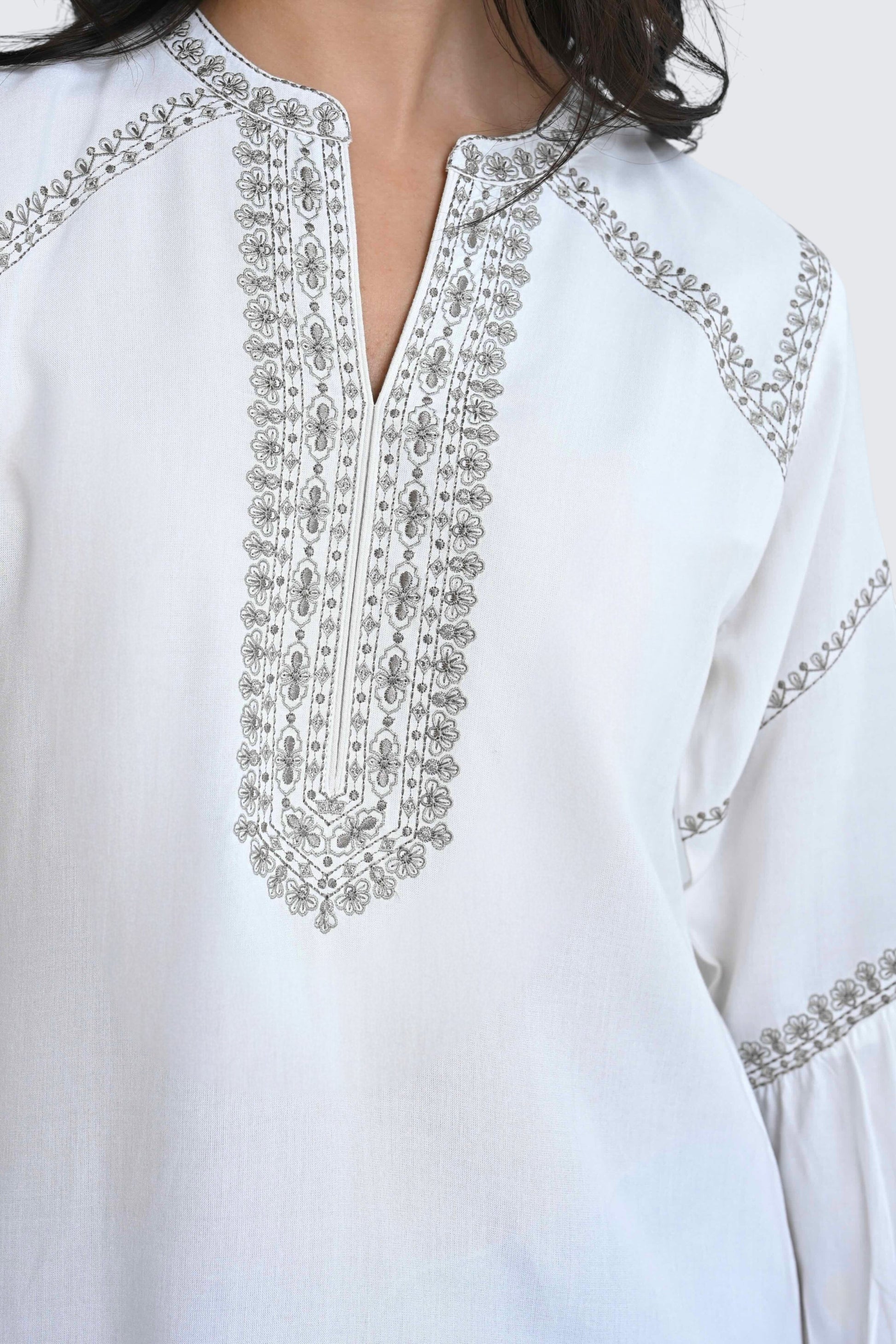 indigrey white June top featuring delicate grey filigree traceline stitch embroidery along the neckline and sleeves