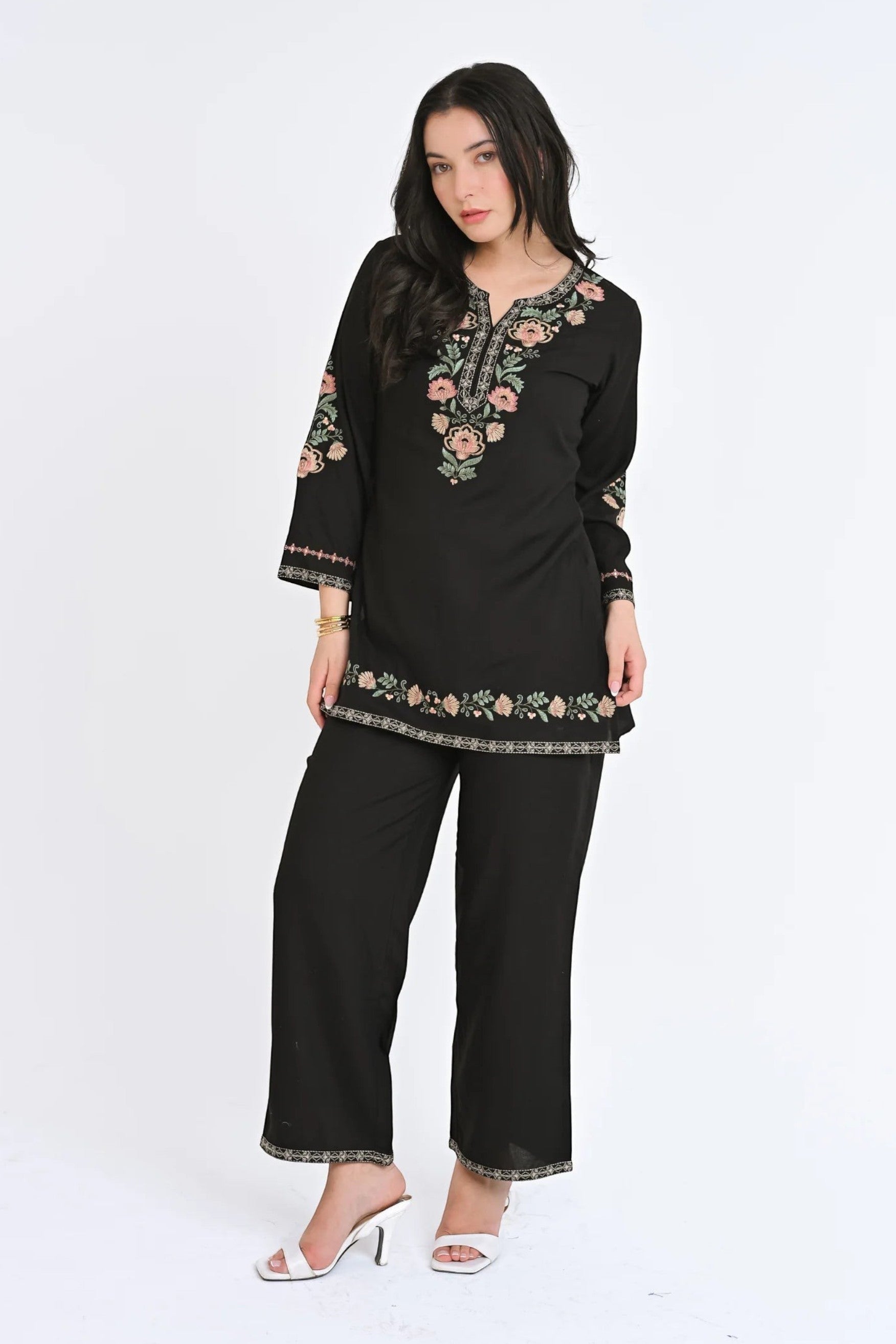 Model wearing indigrey black Kaia co-ord set with Kashmiri-inspired floral stem threadfill embroidery on tunic and pants