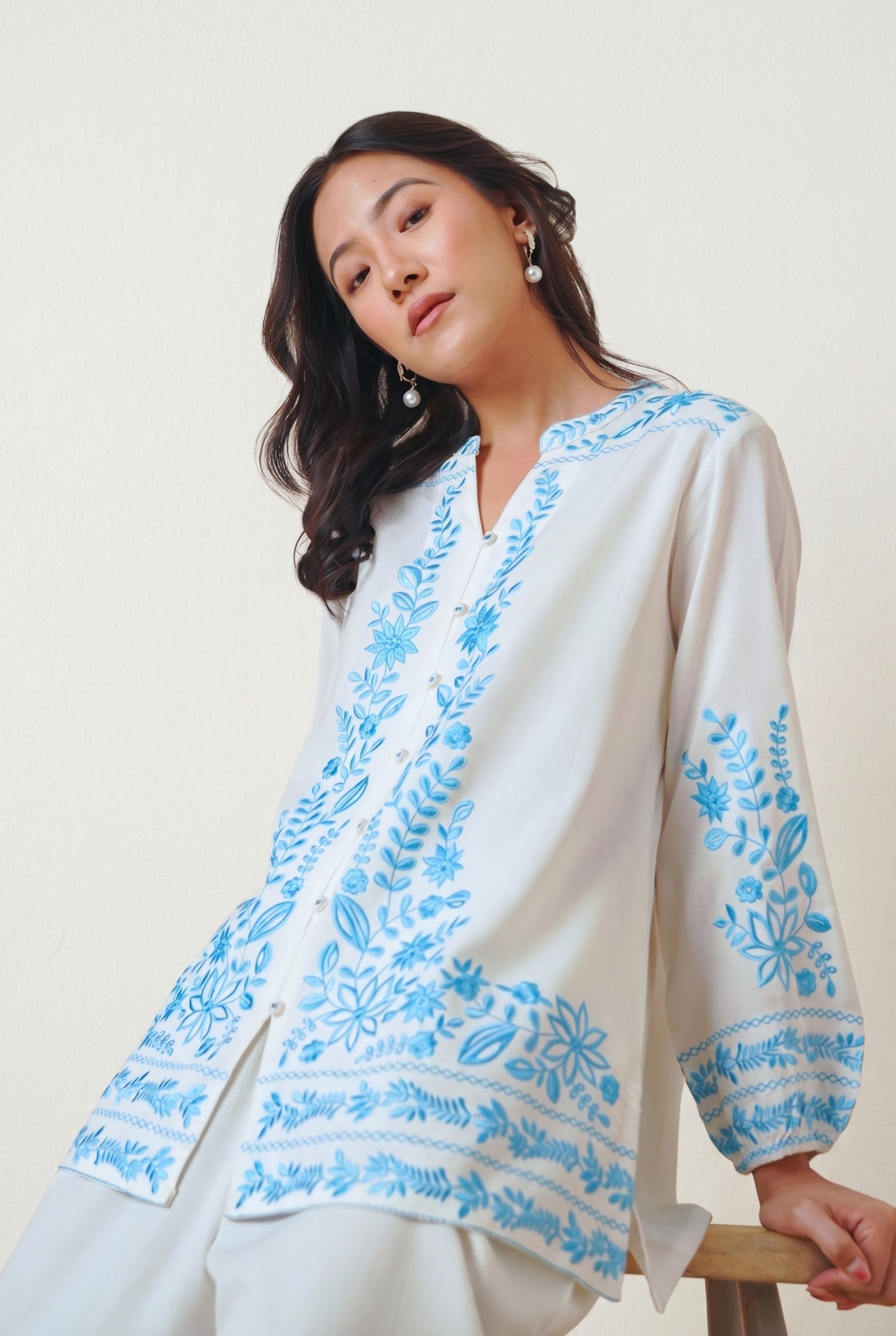 indigrey Luna white viscose shirt with blue floral Tatami embroidery worn by a model