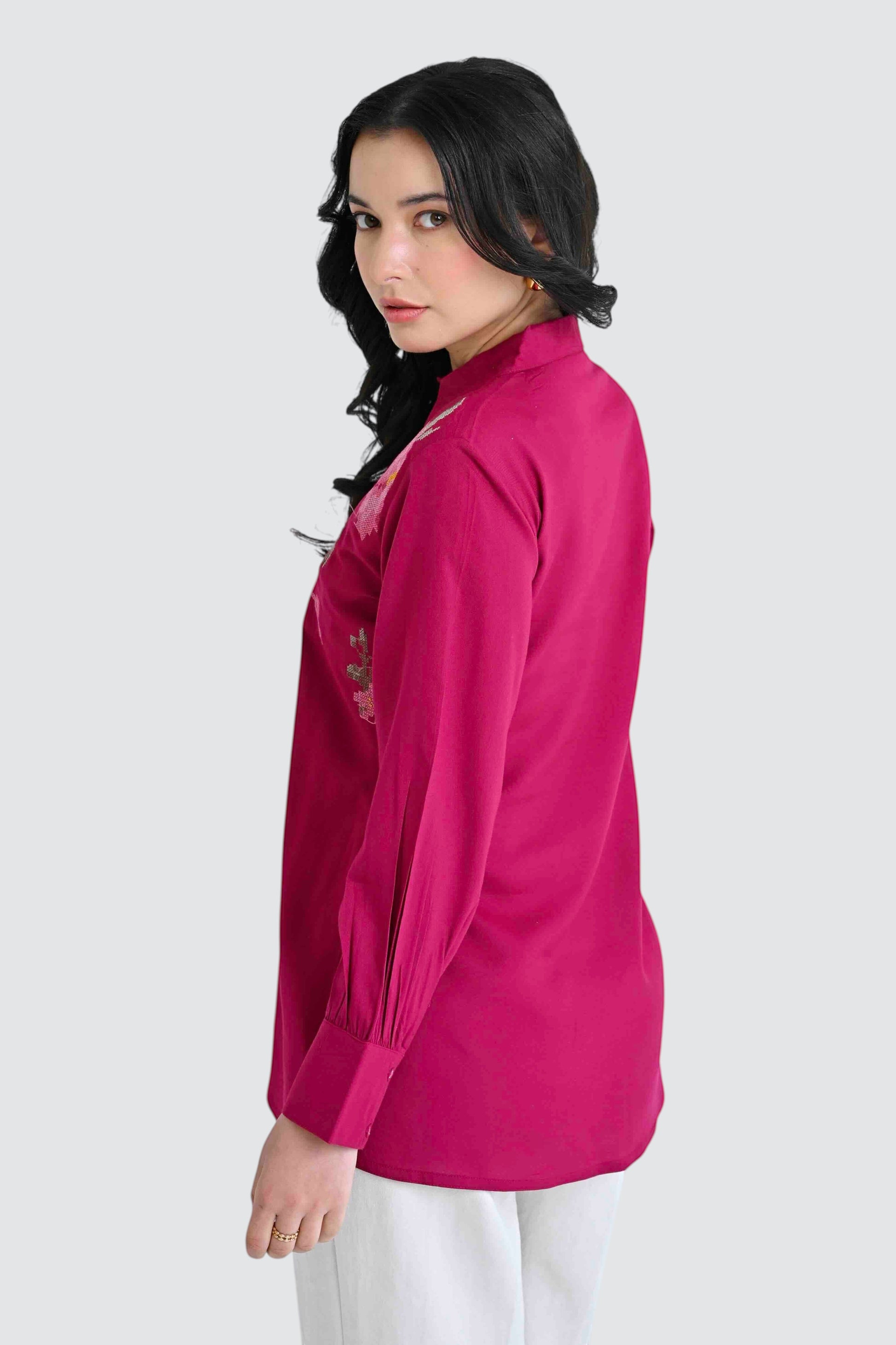indigrey magenta long sleeve button down shirt with floral chest embroidery worn by a woman