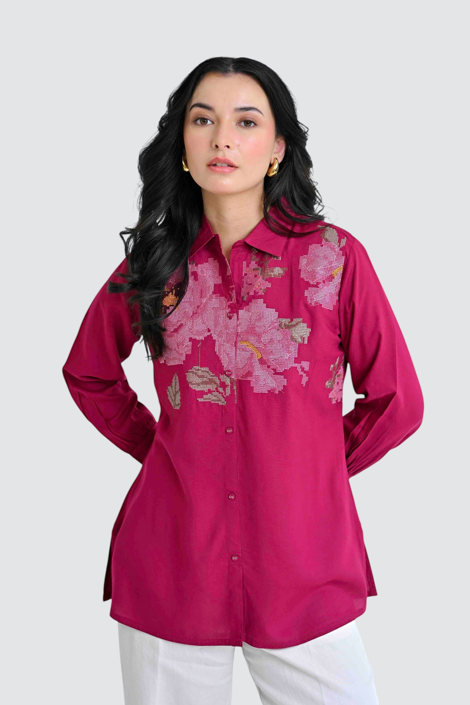 indigrey magenta long sleeve button down shirt with intricate floral chest embroidery worn by a woman
