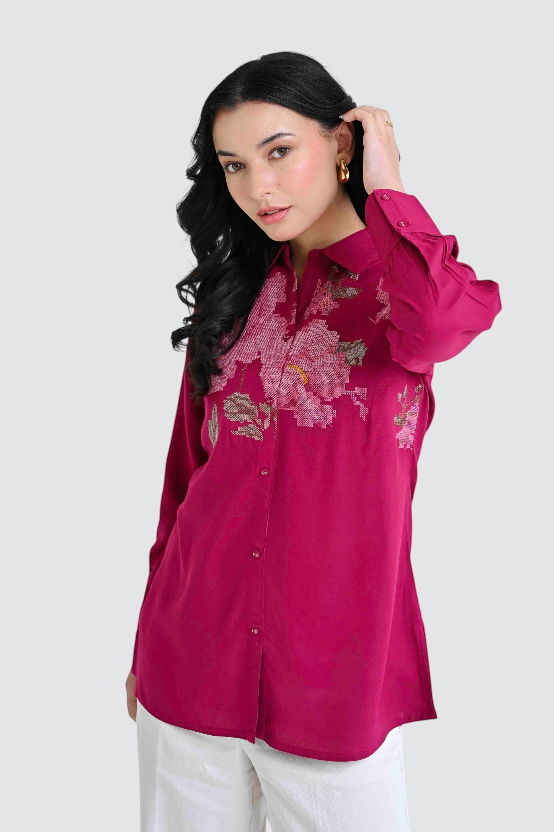 indigrey magenta long sleeve button down shirt with intricate floral chest embroidery worn by a woman