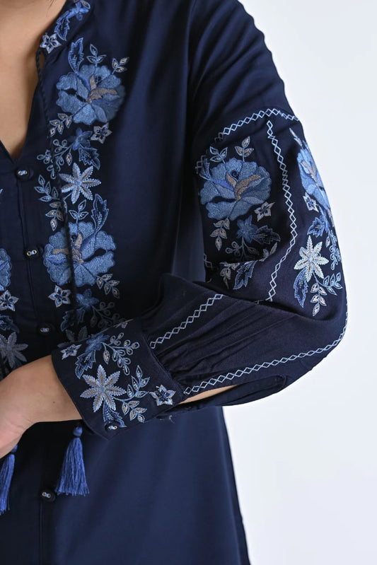 indigrey navy shirt with intricate blue floral embroidery on sleeves and neckline featuring tassel details