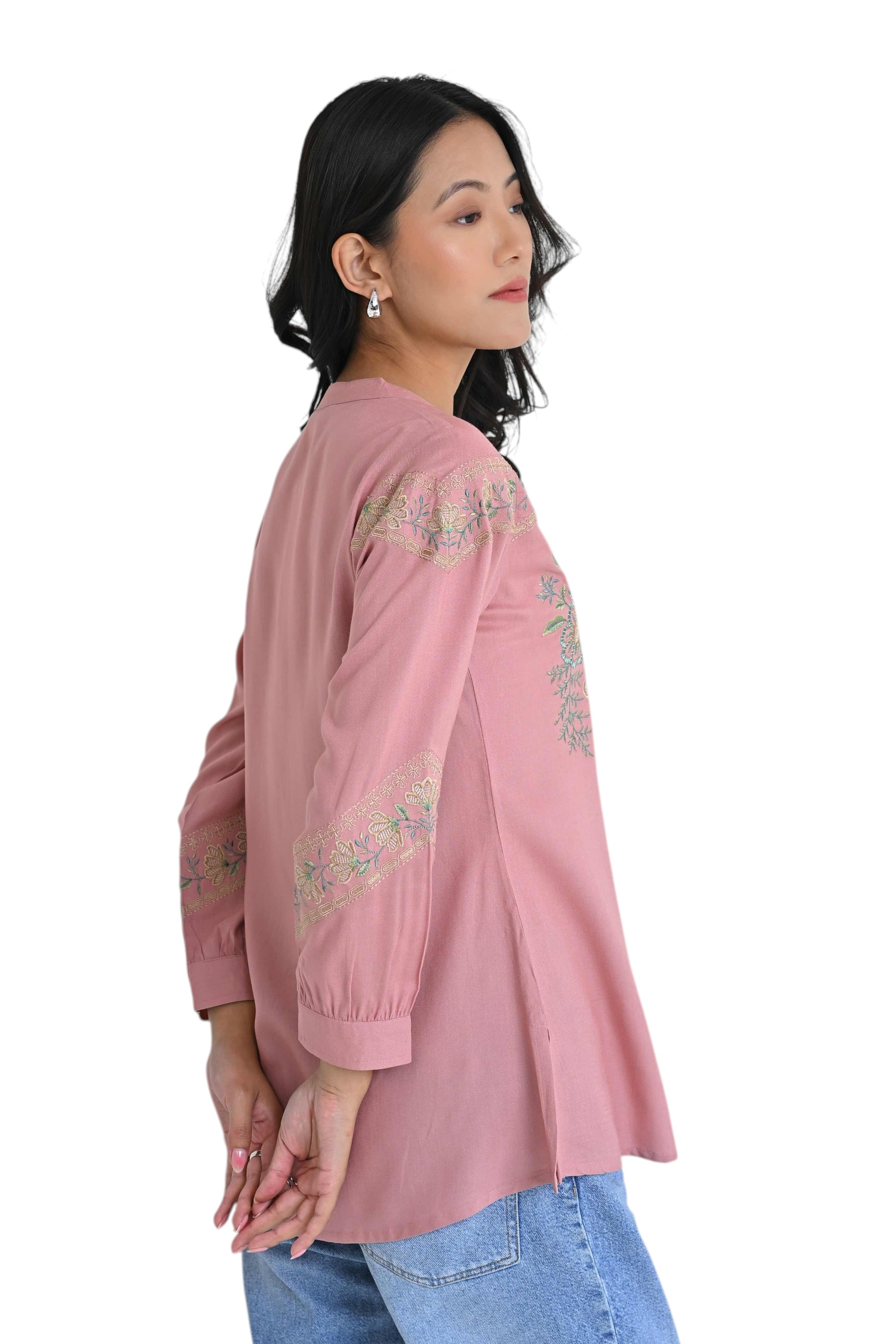 indigrey peach shirt with delicate earthy chain tatami embroidery worn by a model in profile view