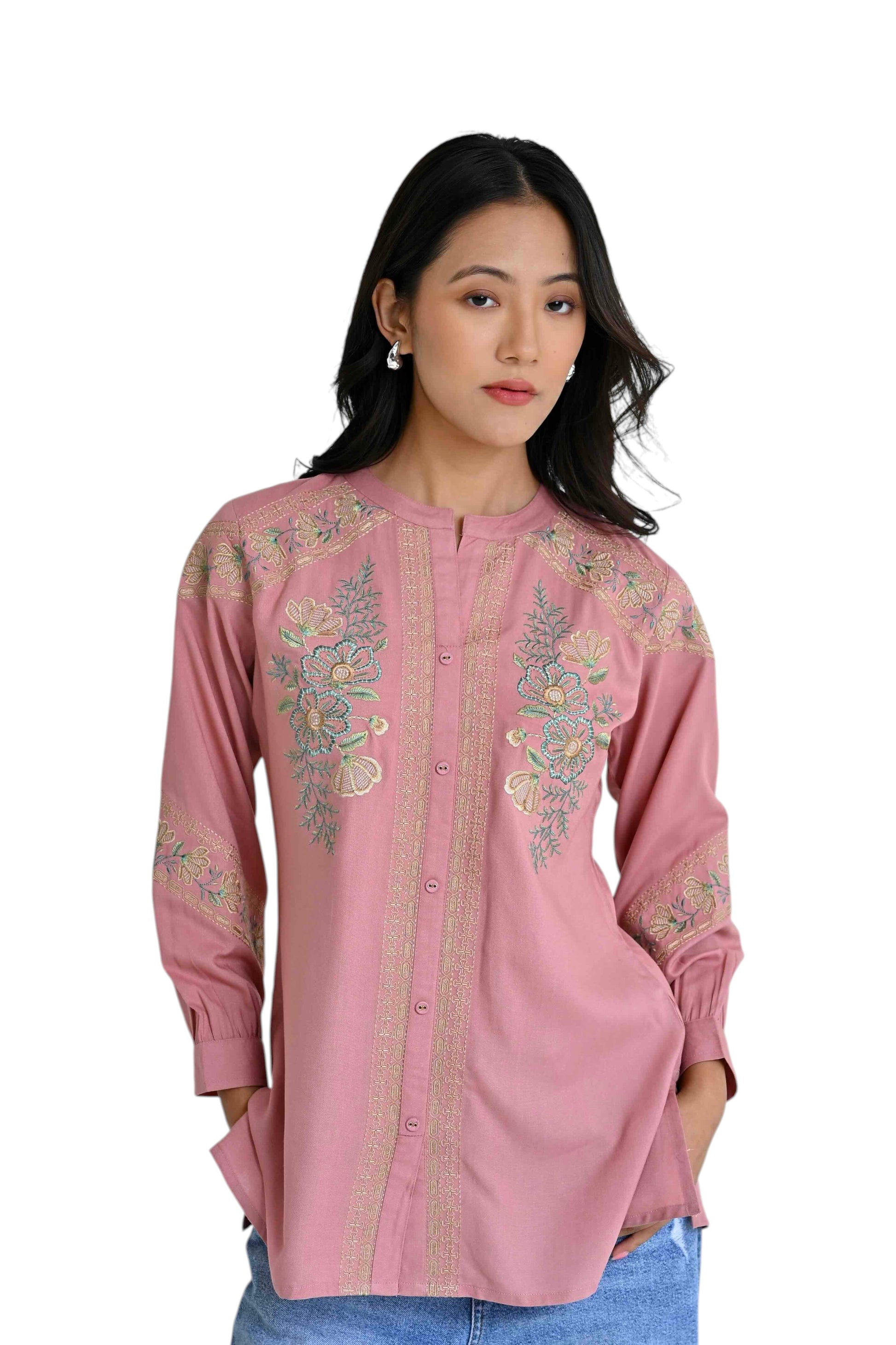 Model wearing an indigrey peach shirt with delicate earthy chain tatami floral embroidery and a button-down front.