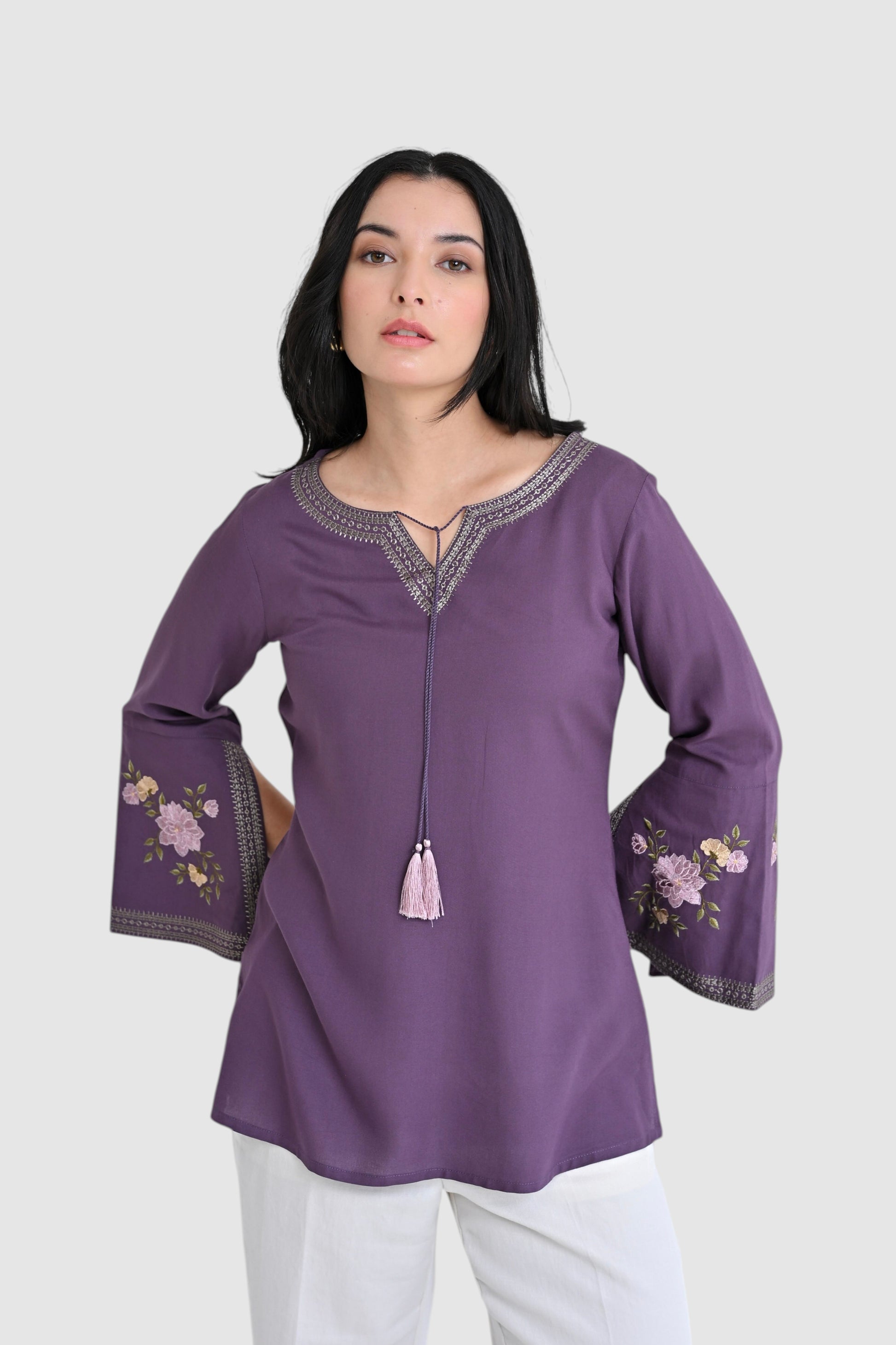 indigrey Zuri purple top with floral Sketchfill Cord embroidery and statement bell sleeves on a model