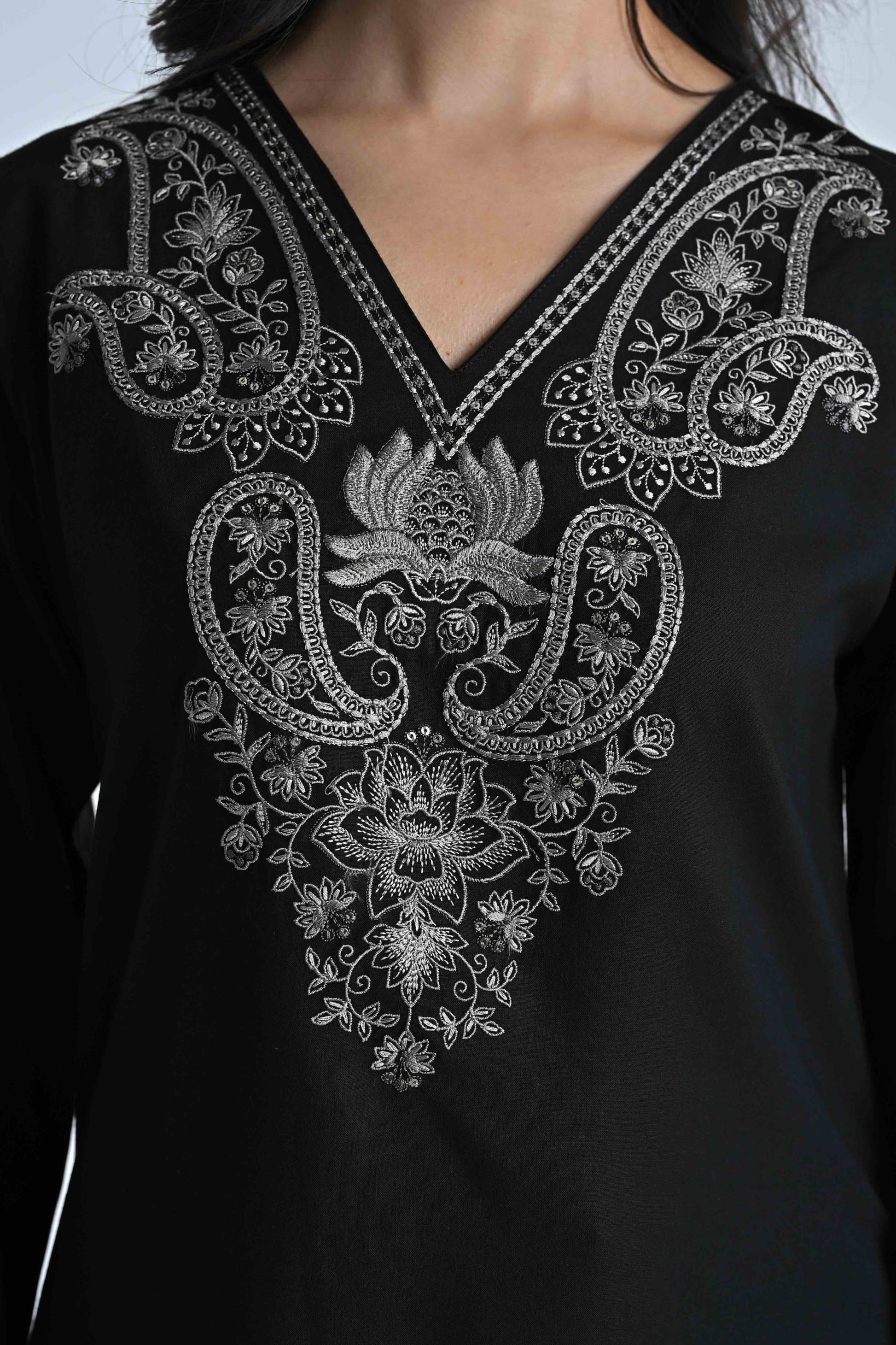 indigrey Raya black V-neck top featuring intricate silver corded stem fill embroidery and flared sleeves.