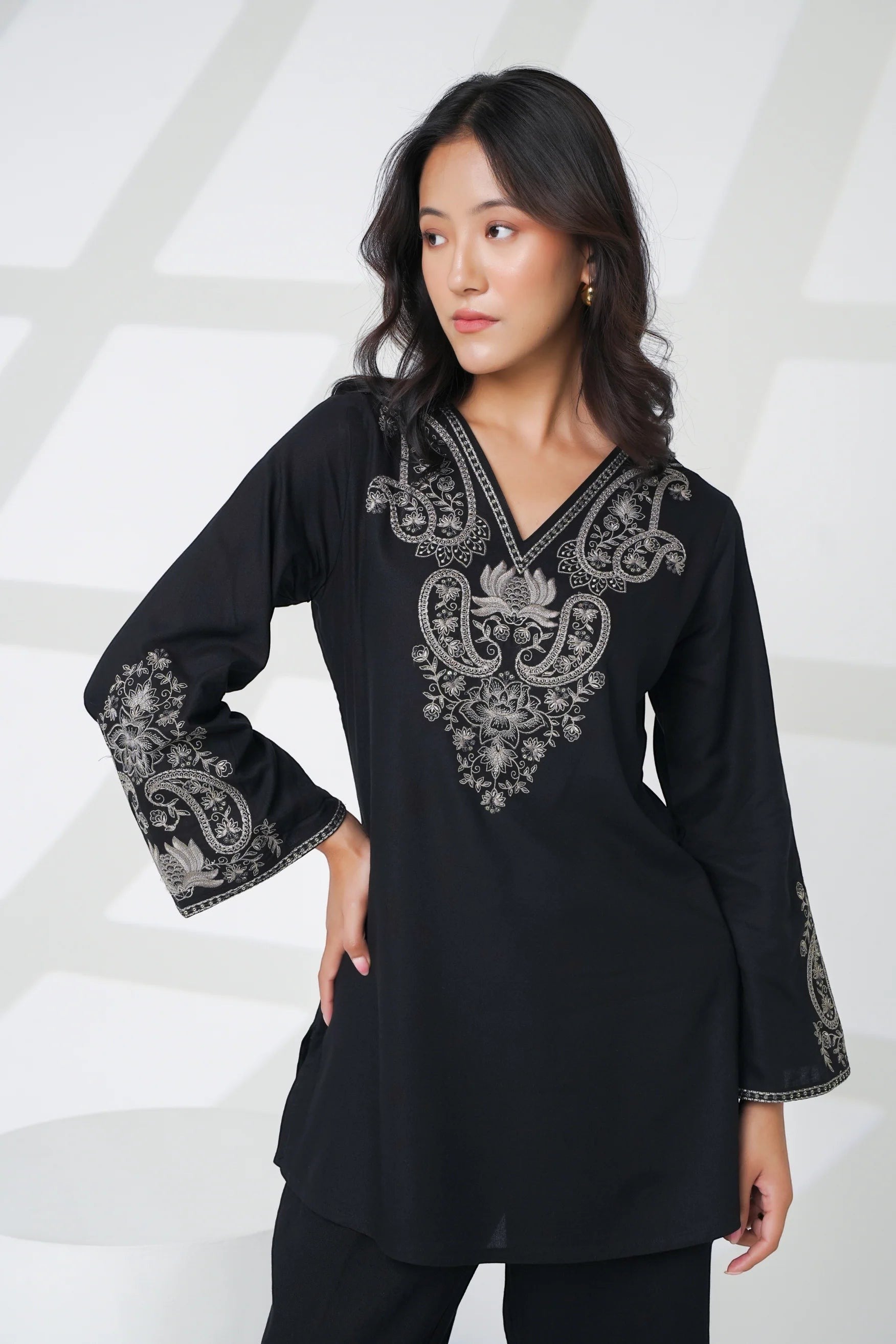 indigrey Raya black V-neck top with intricate grey corded stem fill embroidery on the chest and flared sleeves.