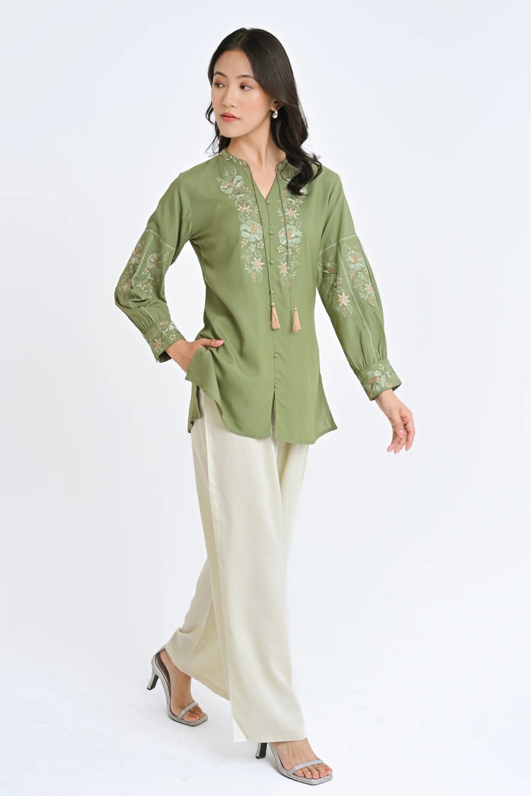 indigrey sage green Ivy shirt with fly brick stitch floral embroidery on neckline and sleeves and tassel hem details