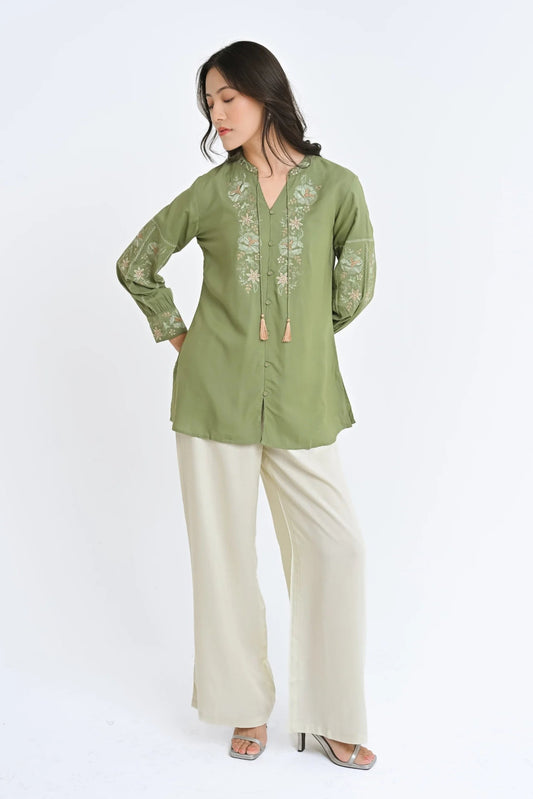 indigrey sage Ivy shirt featuring Fly Brick stitch floral embroidery on neckline and sleeves with tassel hem details