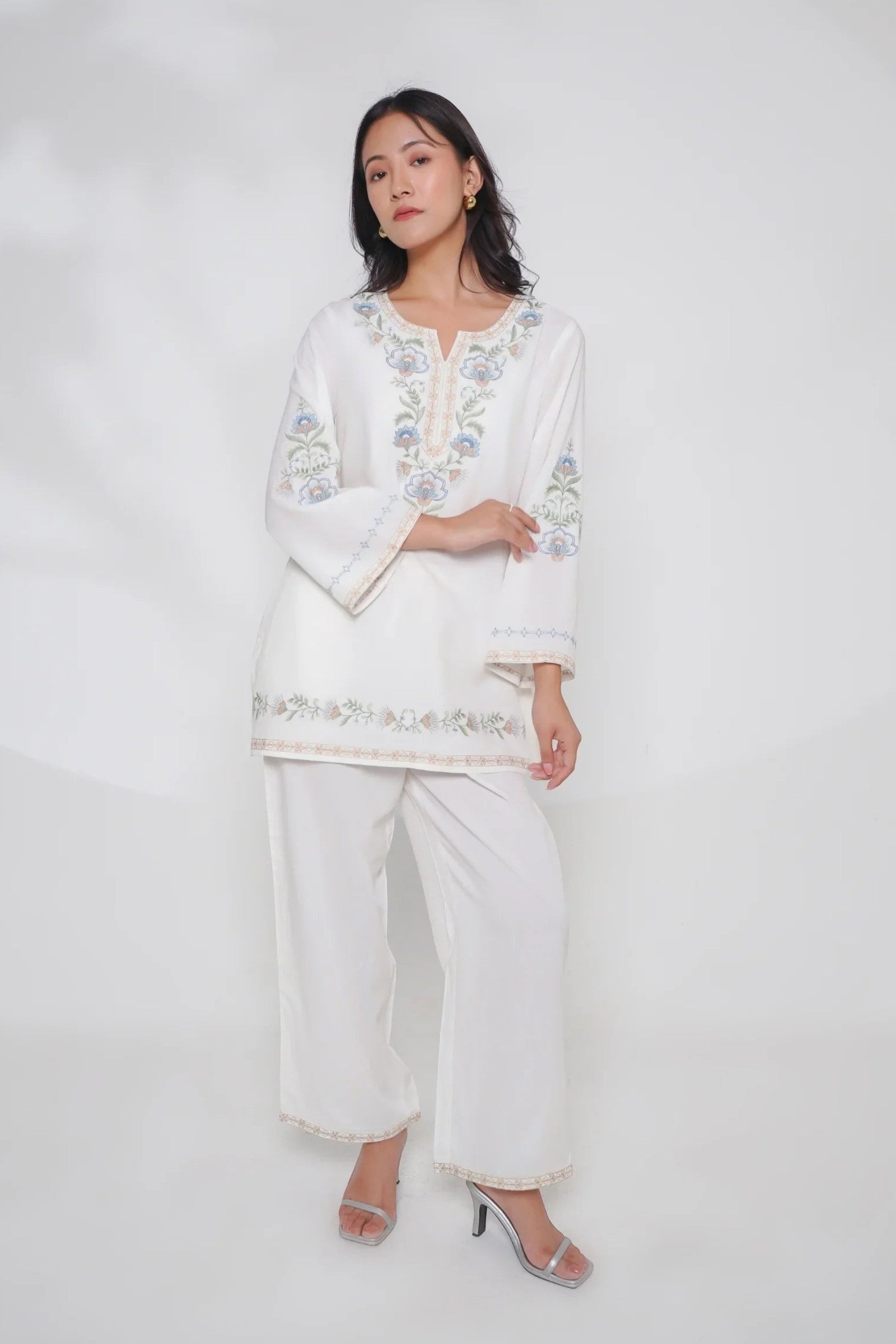 Model wearing indigrey white co-ord set with delicate Kashmiri-inspired stem threadfill embroidery on neckline