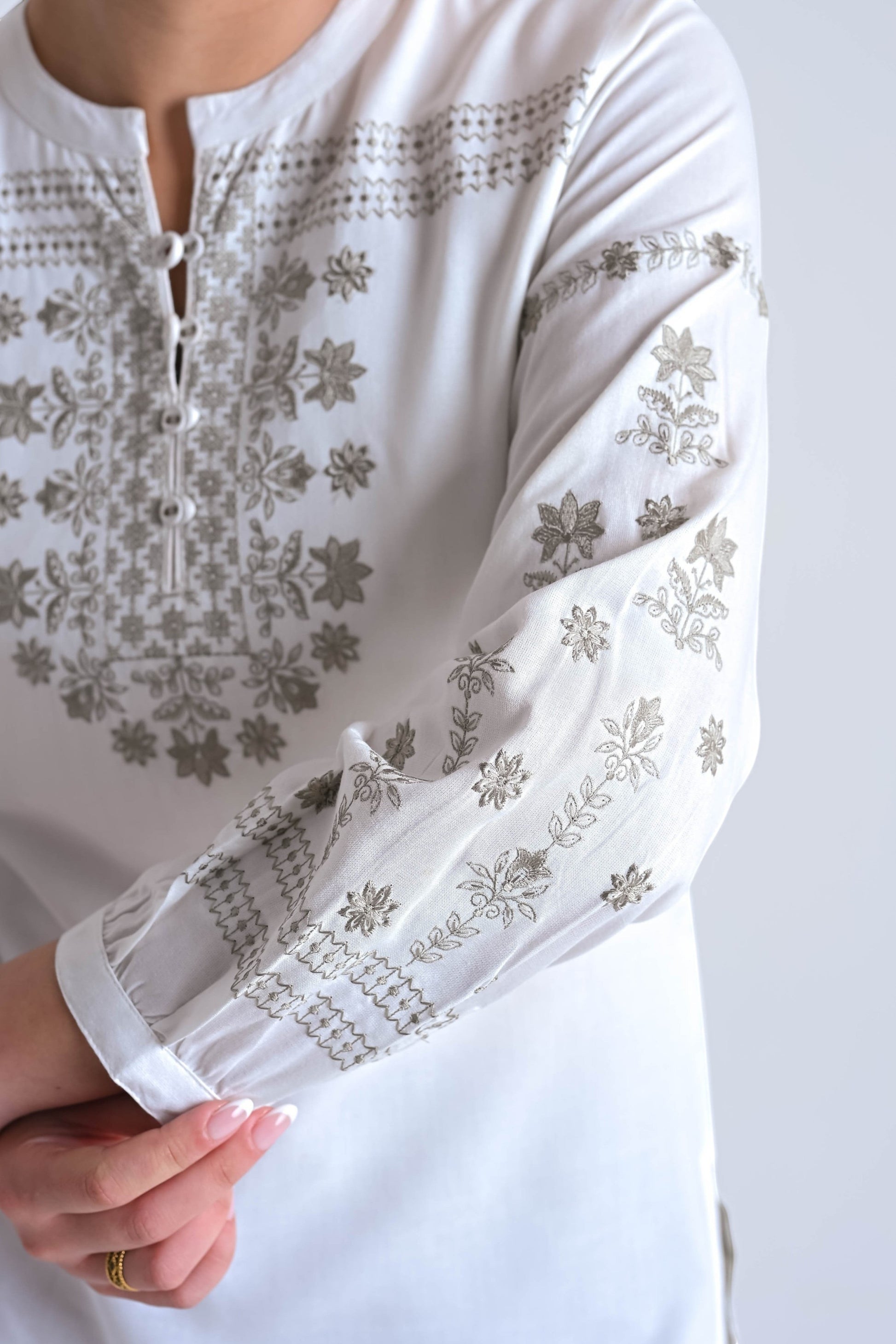 indigrey white top with intricate grey floral latticework embroidery, mandarin collar, and long sleeves.