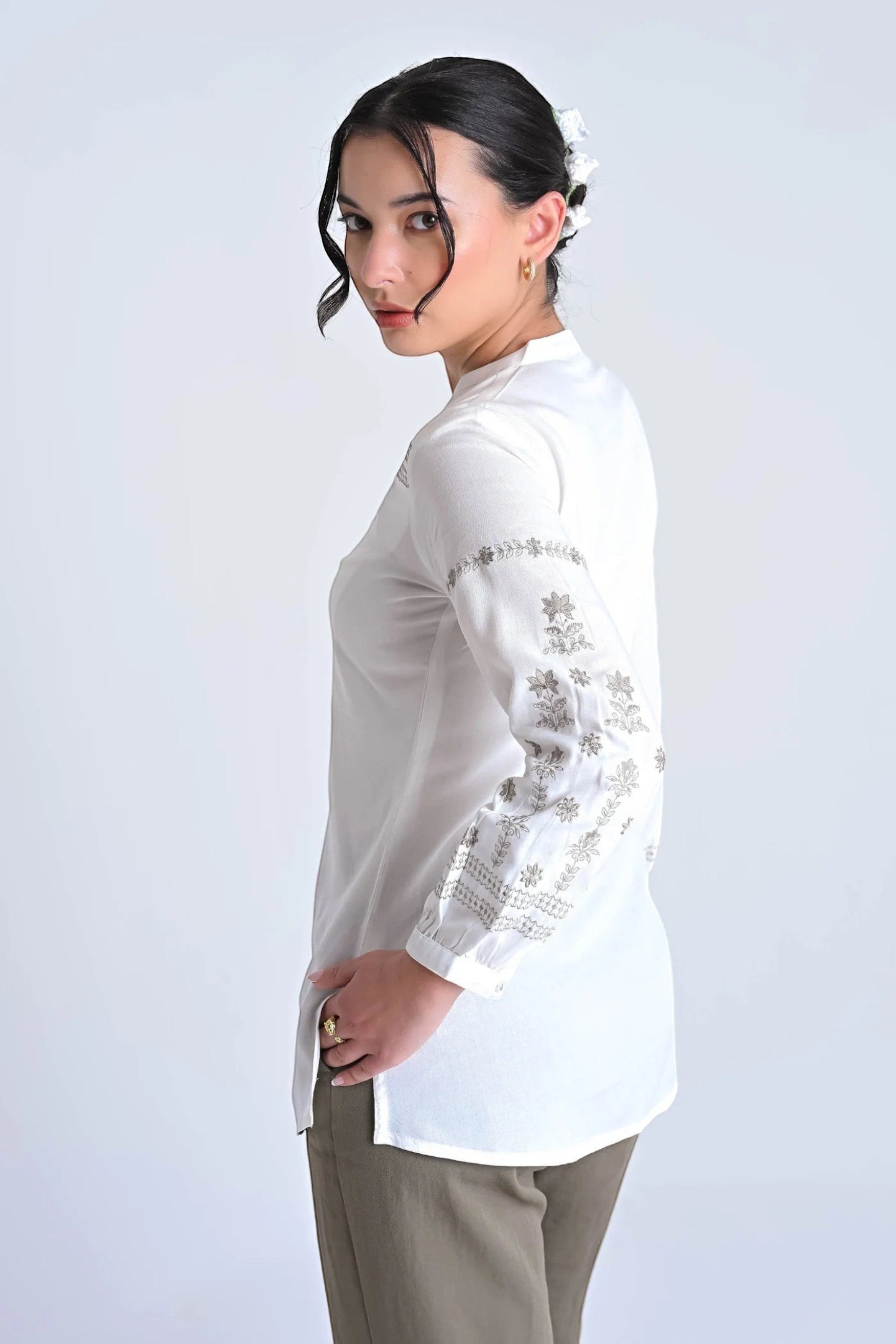 indigrey white long-sleeve blouse with earth-toned mosaic embroidery on sleeves and mandarin collar, side view