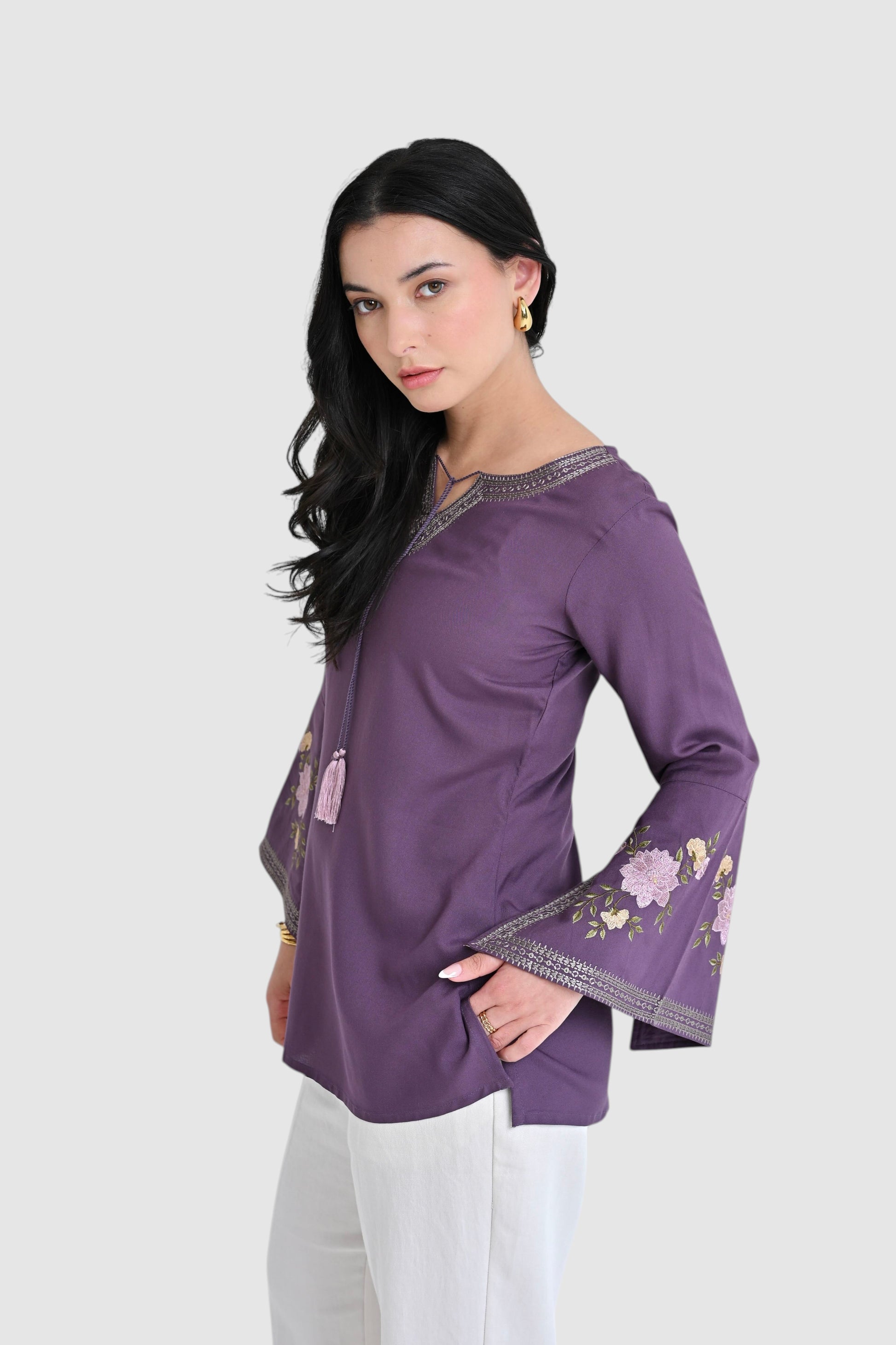 indigrey Zuri purple top with floral embroidery and flared bell sleeves worn by a model against a white background