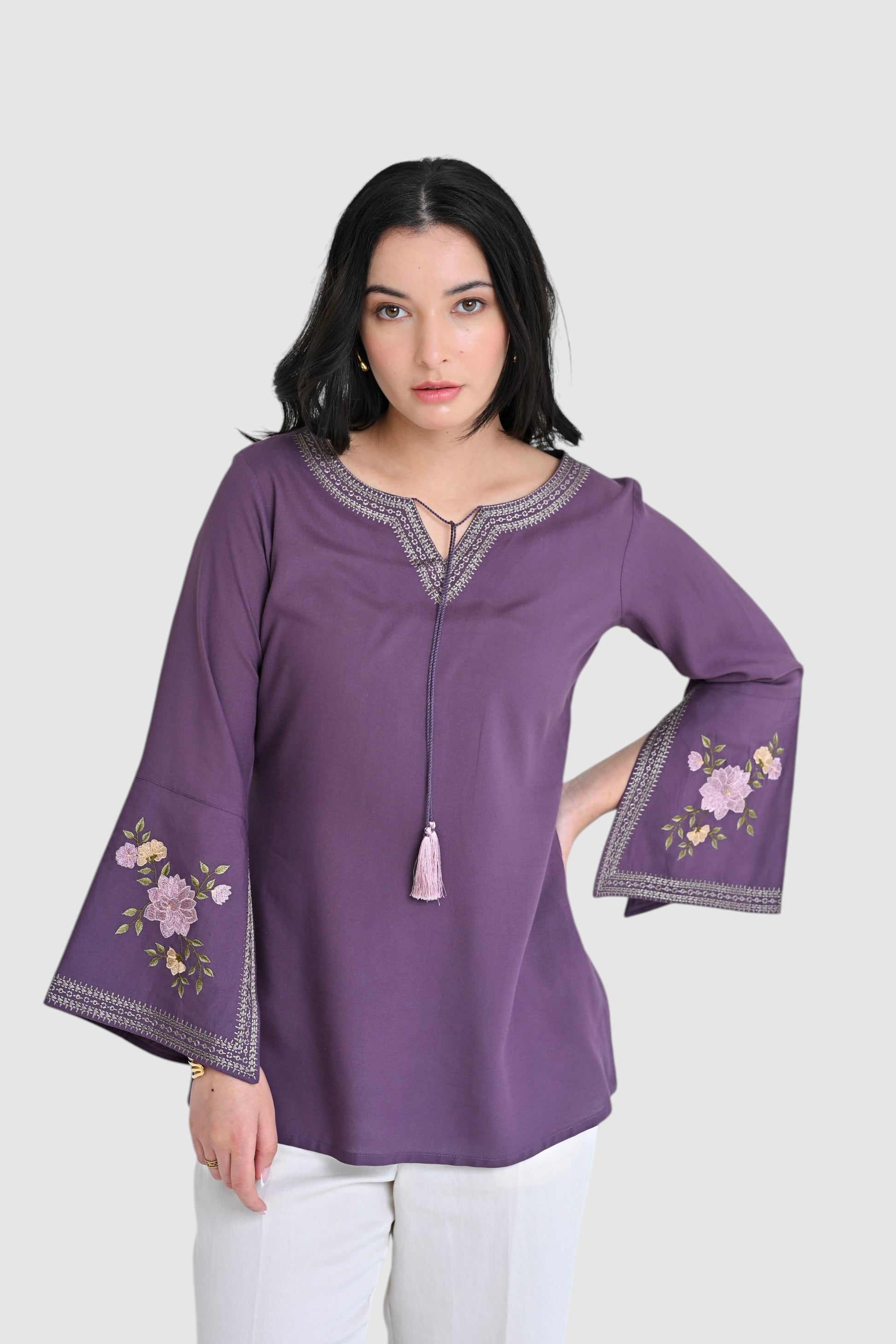 indigrey Zuri purple top with floral embroidery and flared bell sleeves worn by a model against a white background
